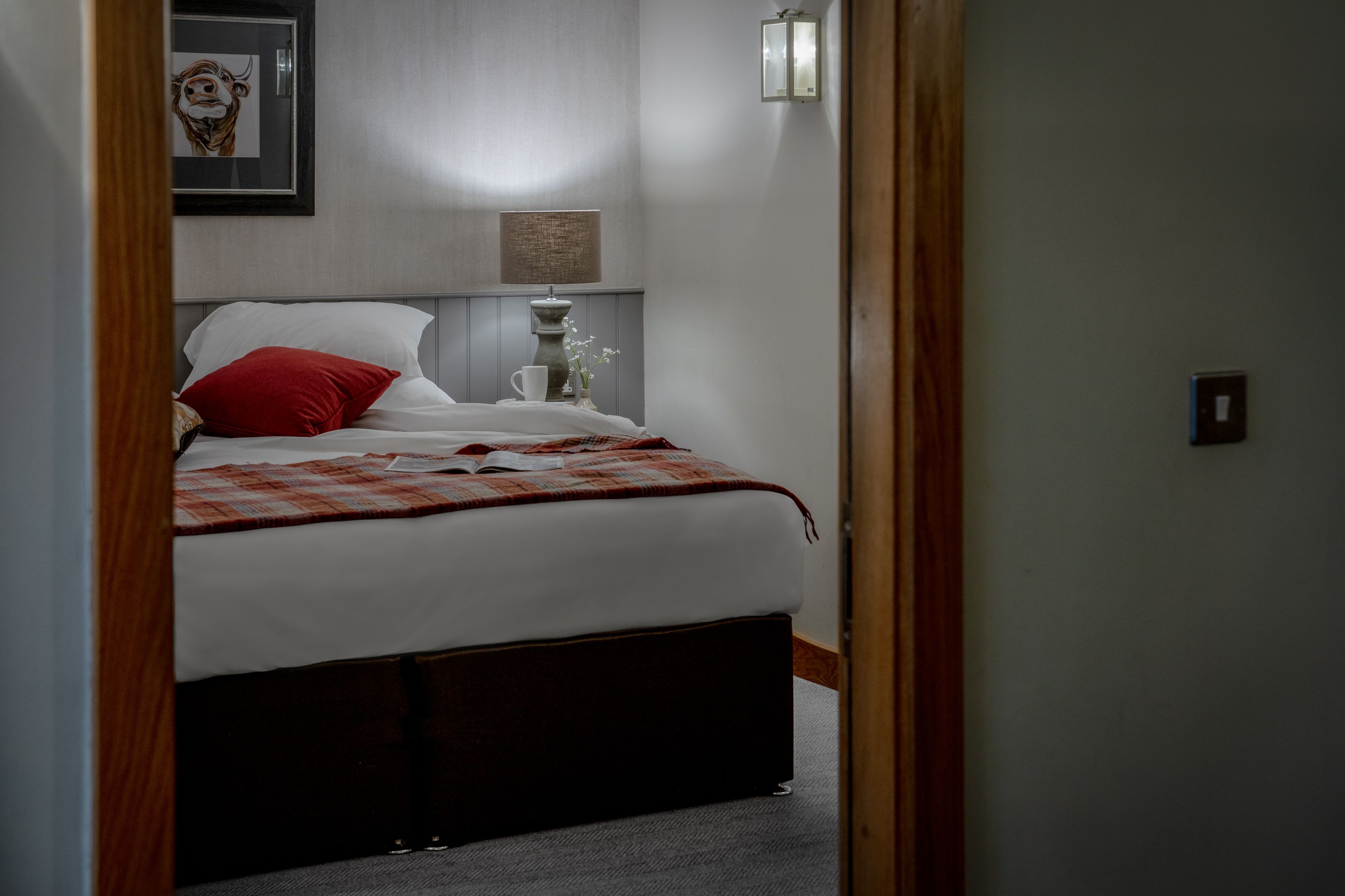 turned down bed with magazine