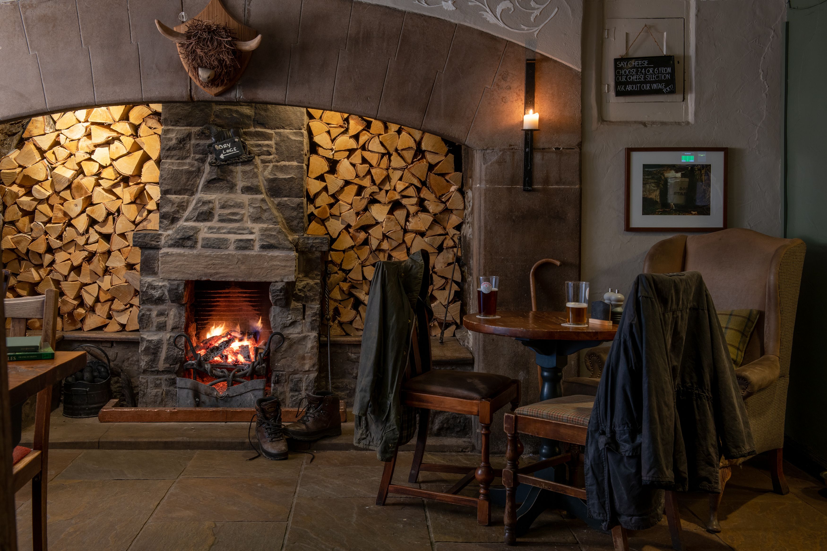 table with drinks in front of fire