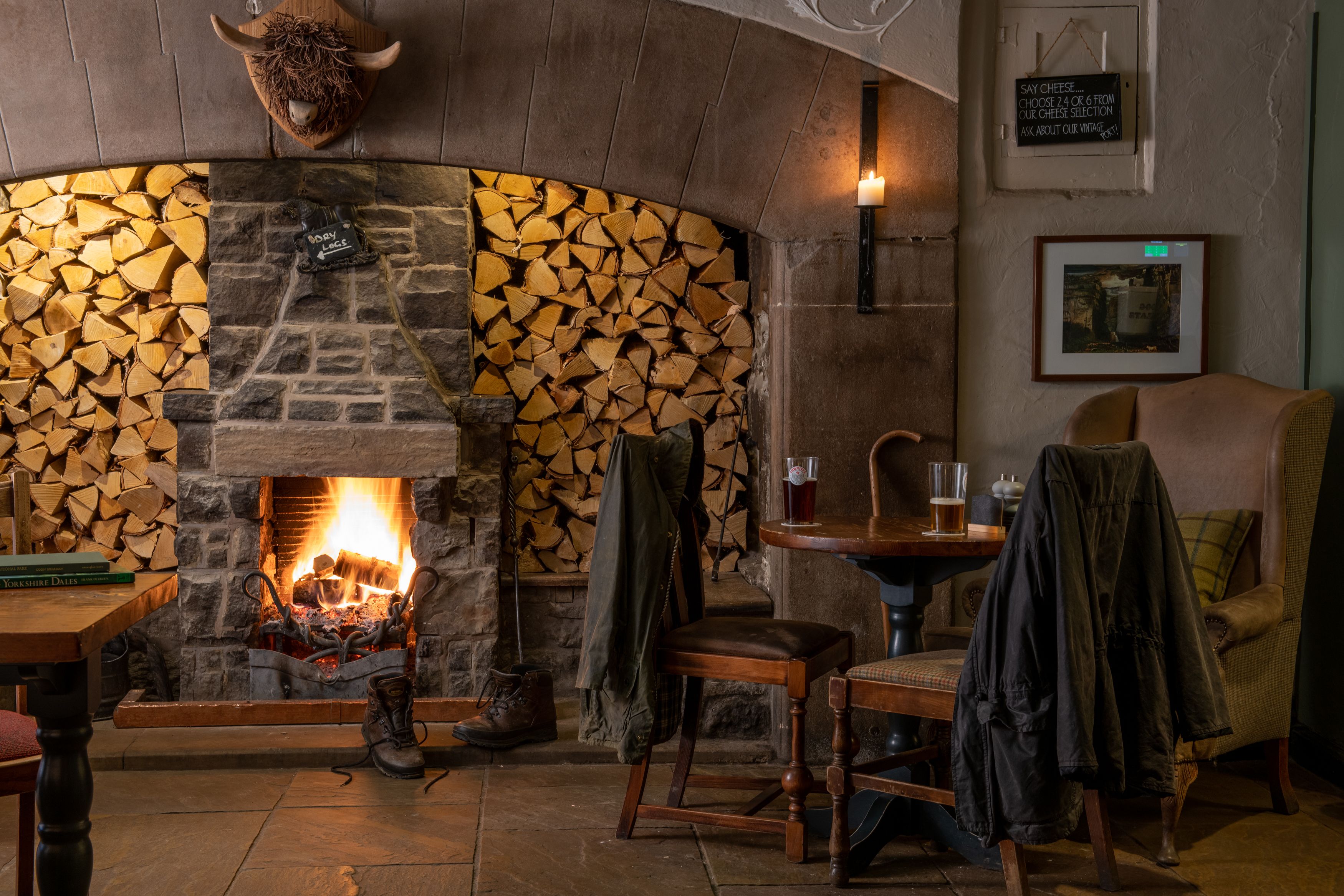 table with drinks in front of fire