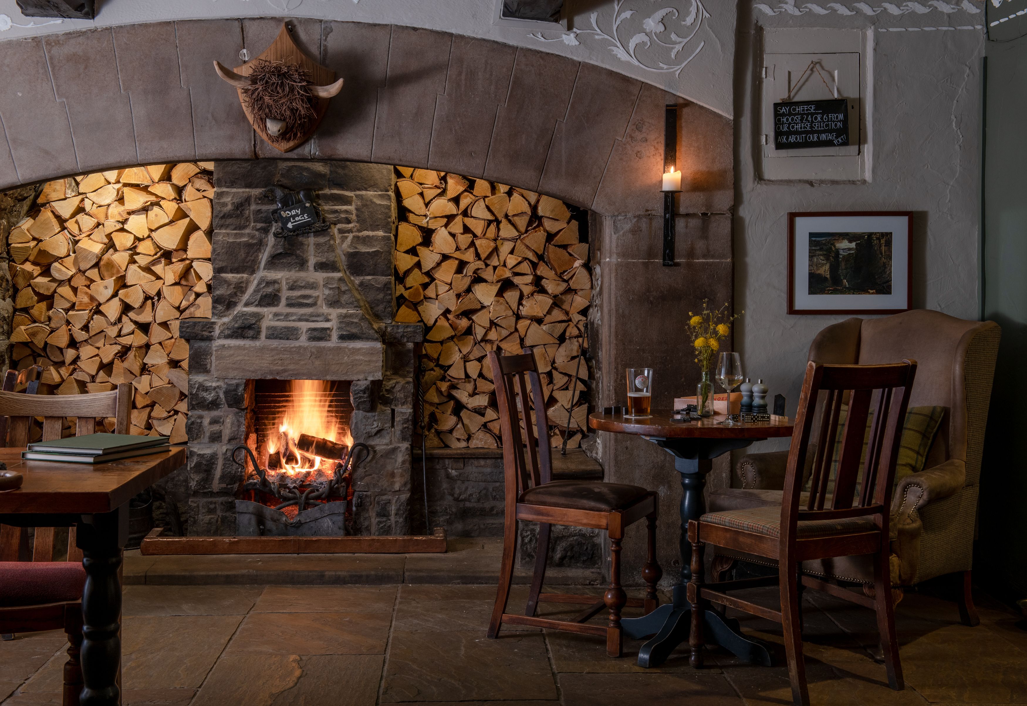 table with drinks in front of fire