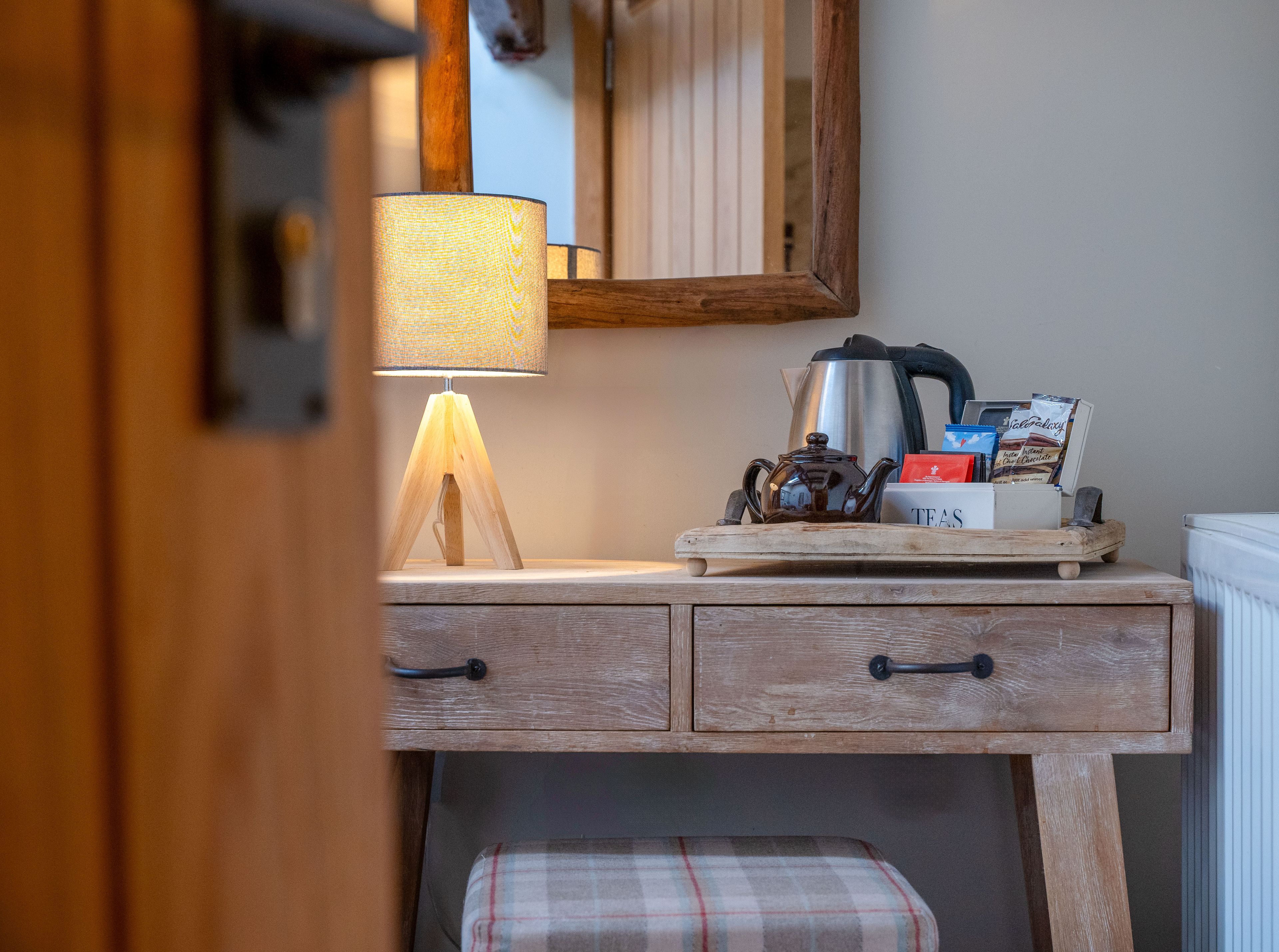 feature room wood desk and coffee station