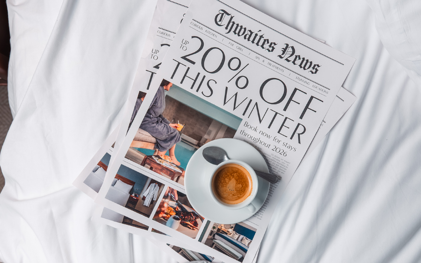 "up to 20% off this winter" newspaper with coffee on a hotel bed