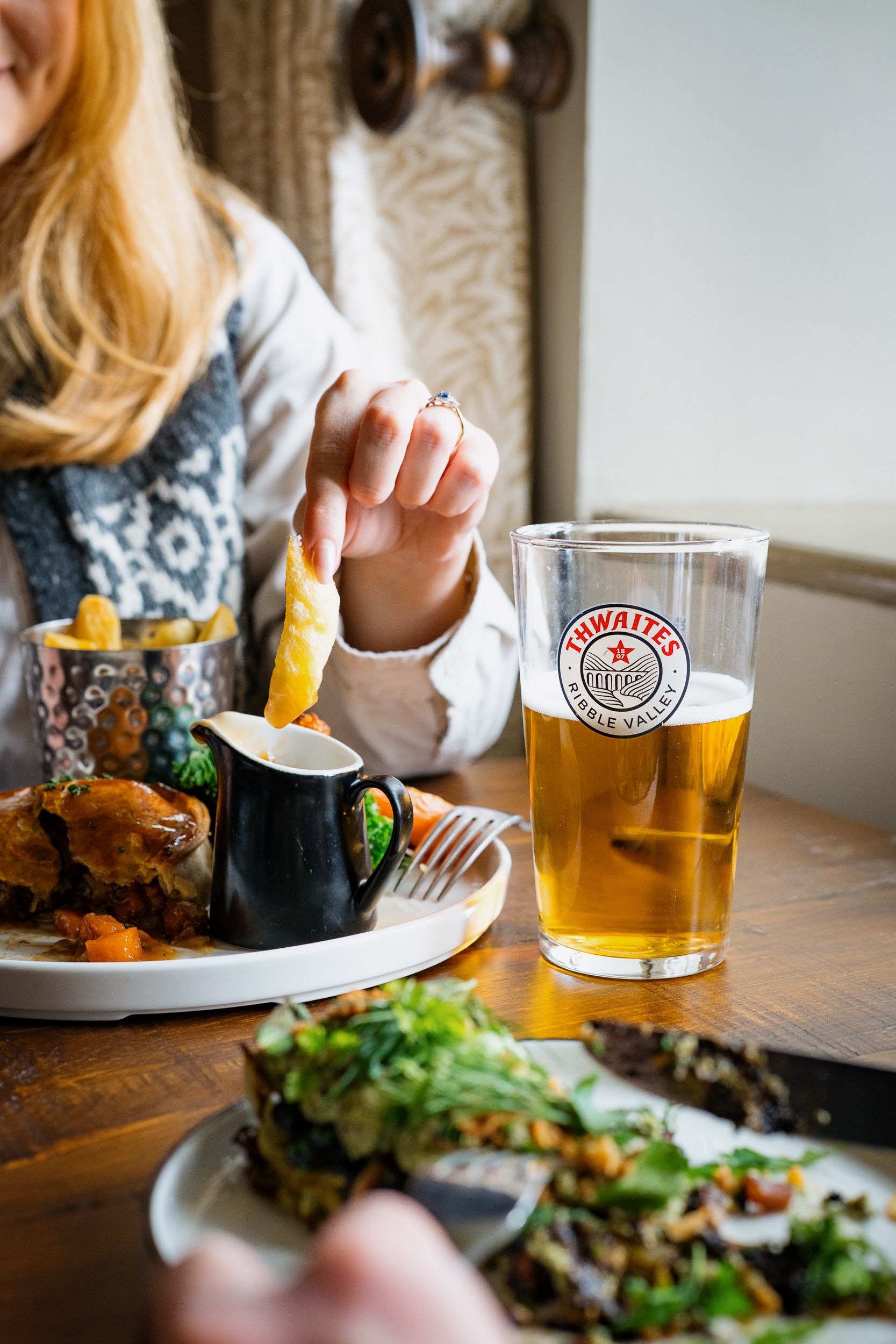 pie and chips with a pint of thwaites ale